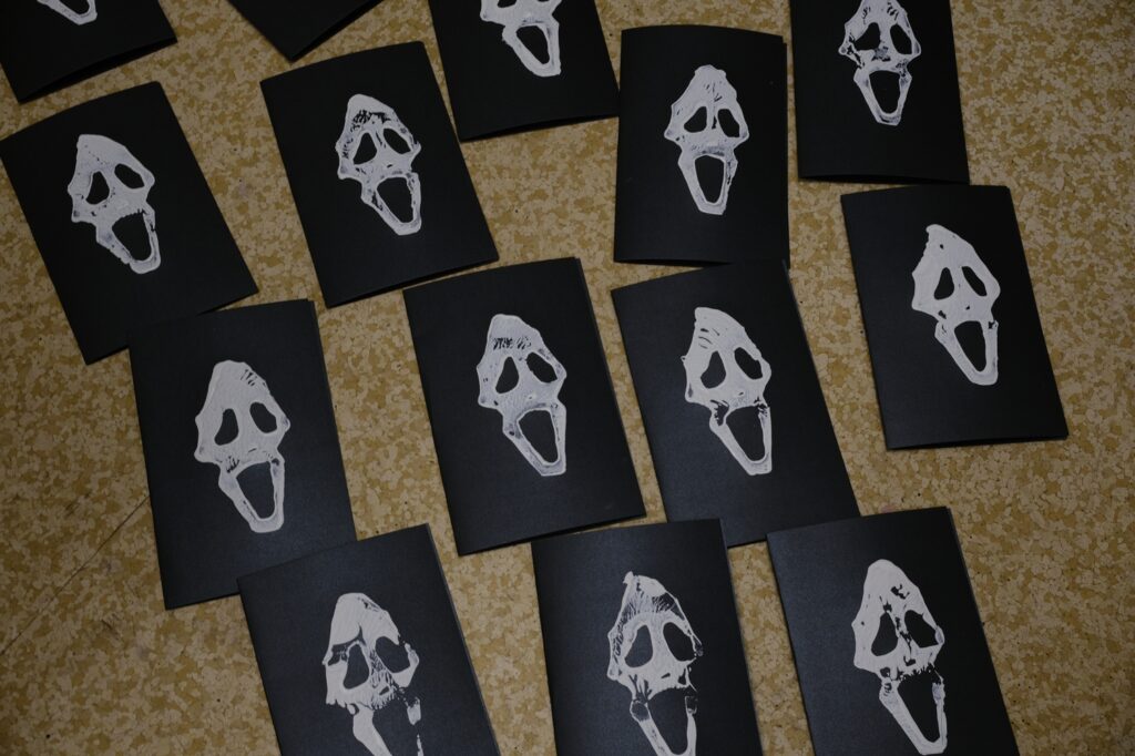 Several copies of the Scream Zine by Sara Century available at saracentury.gumroad.com